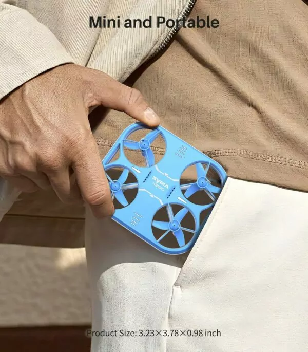 Person holding a compact blue drone in their hand, showcasing its portable design for easy storage and transport.